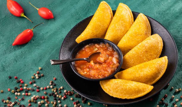 Fried empanadas with spicy sauce – typical Colombian food